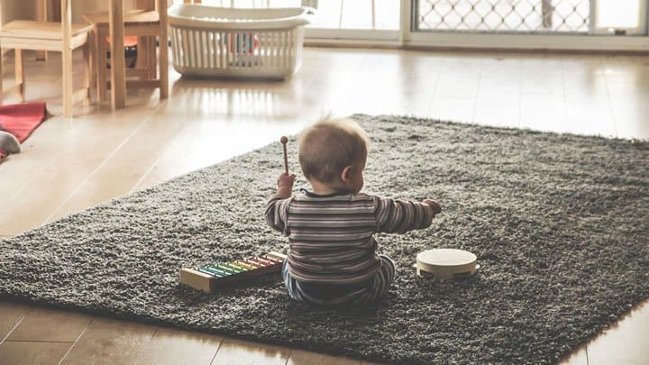 Baby playing instrument