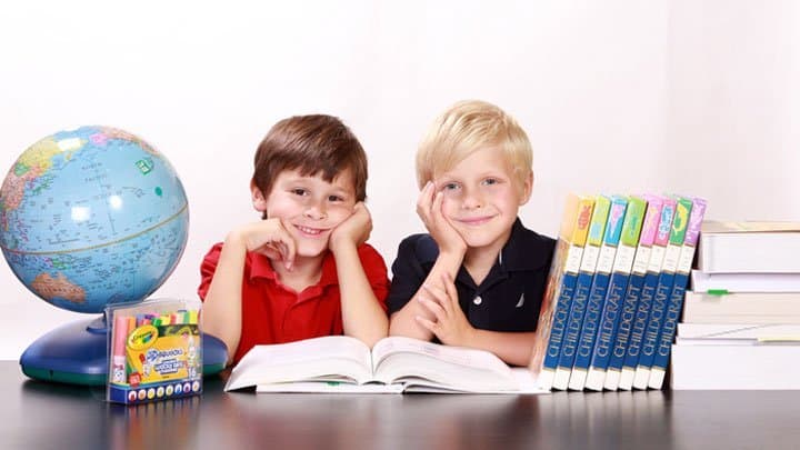 twins in school reading books