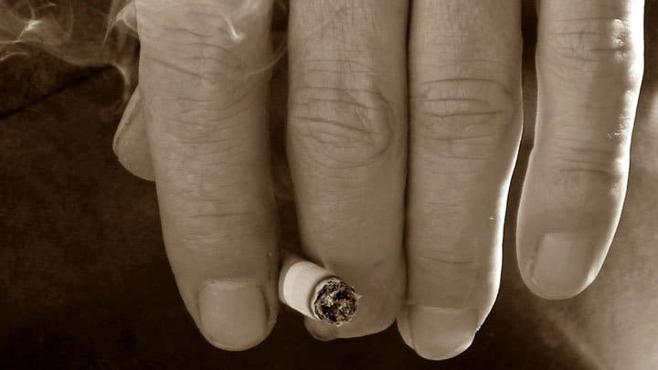Hand holding cigarette