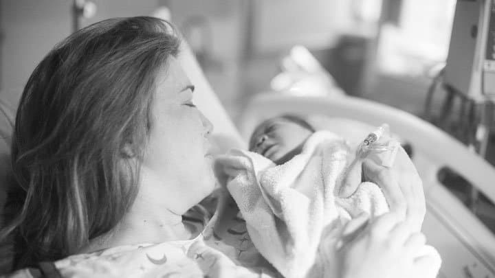 mother holding newborn baby