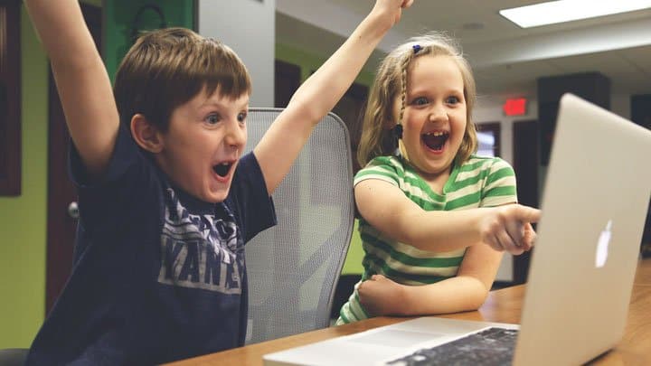 Boy and girl using a computer