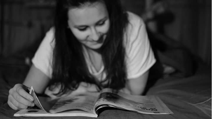 Woman reading magazine