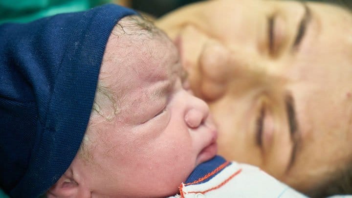 Woman with newborn child